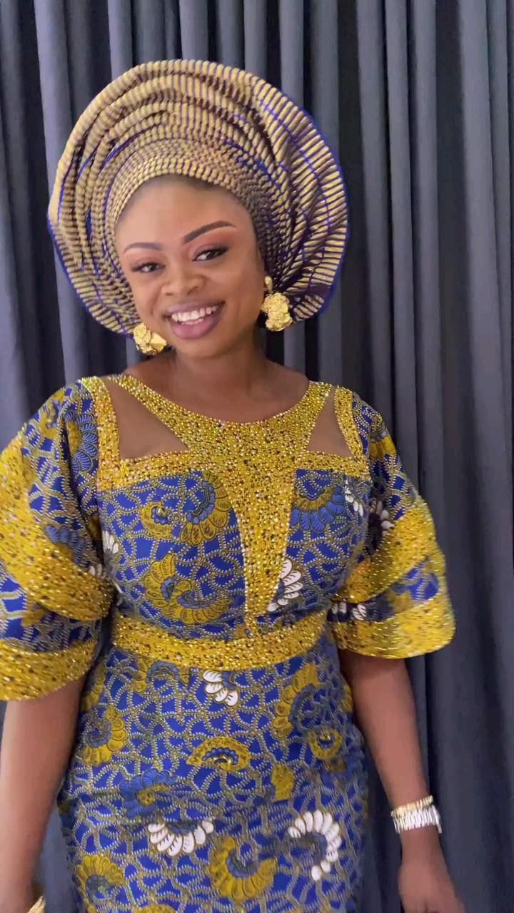 This contains an image of Ankara Gown Style