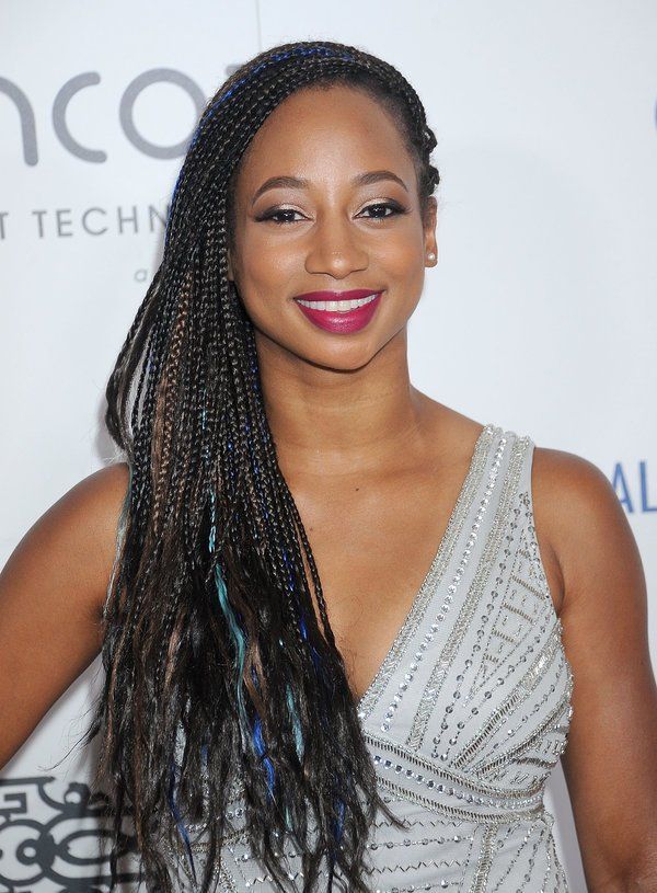 monique coleman showing one side swept box braids