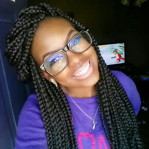 13 box braids and glasses