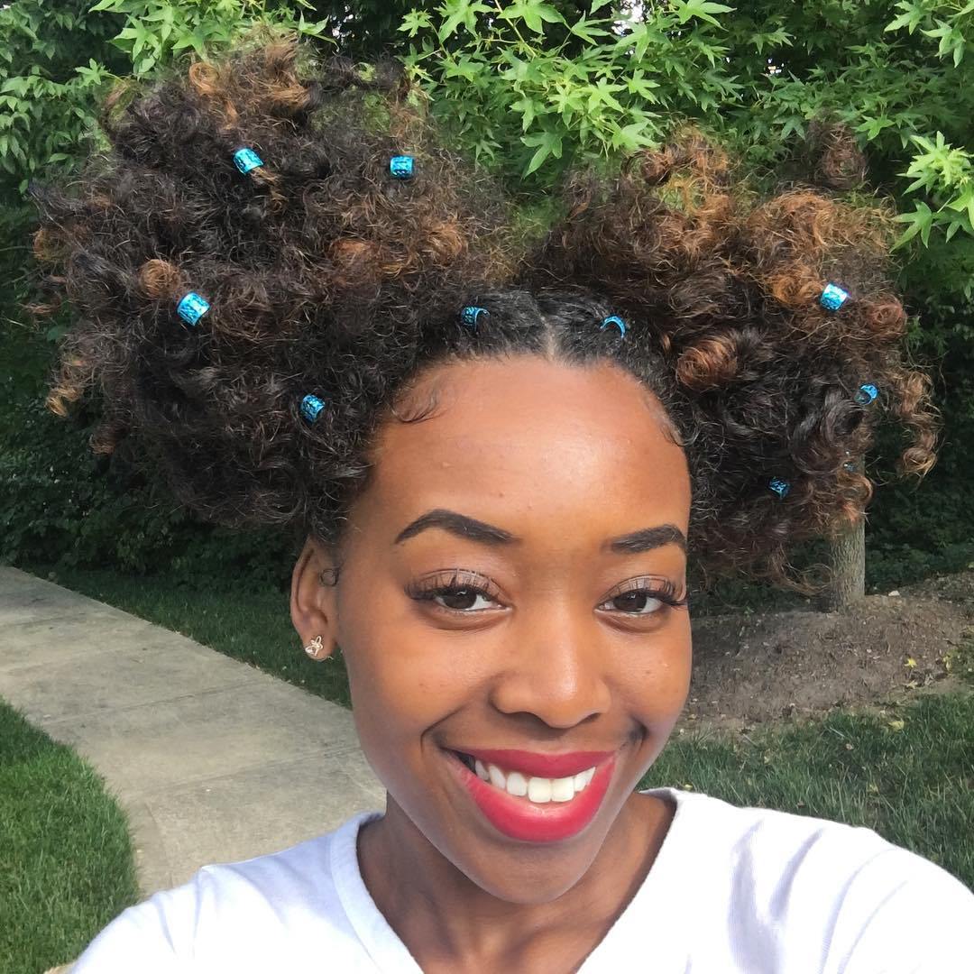 Two Curly Buns With Hair Clips