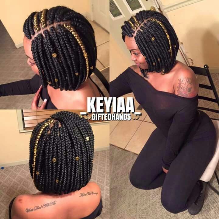 bob box braids with gold highlight and hair accessories.