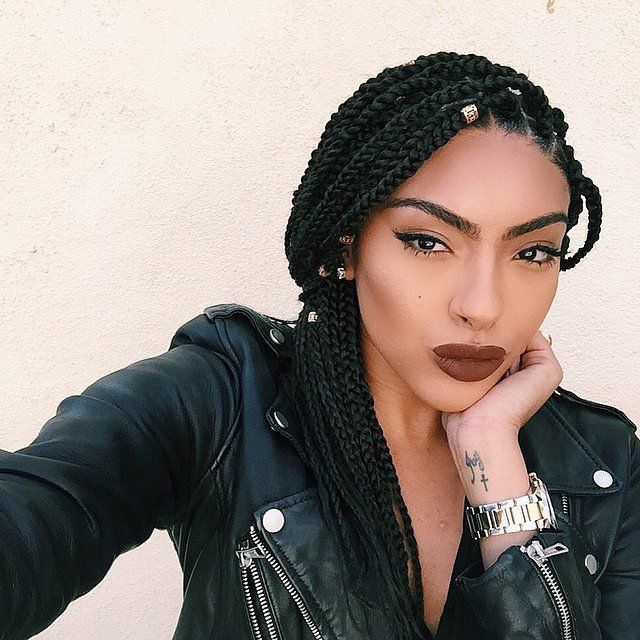 box braids are a perfect summer hairstyle for black women. the braided hairstyle with weave requires minimal maintenance making it an easy vacation h