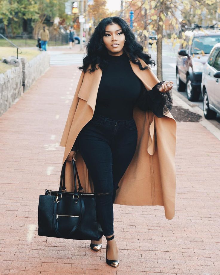 love this all black ensemble paired with a camel coat.