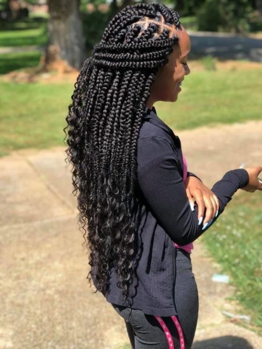 large bohemian box braids with curls 