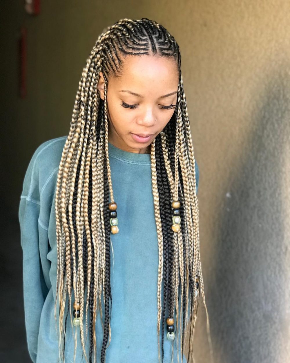 blonde Ghana braids with beads and cornrows