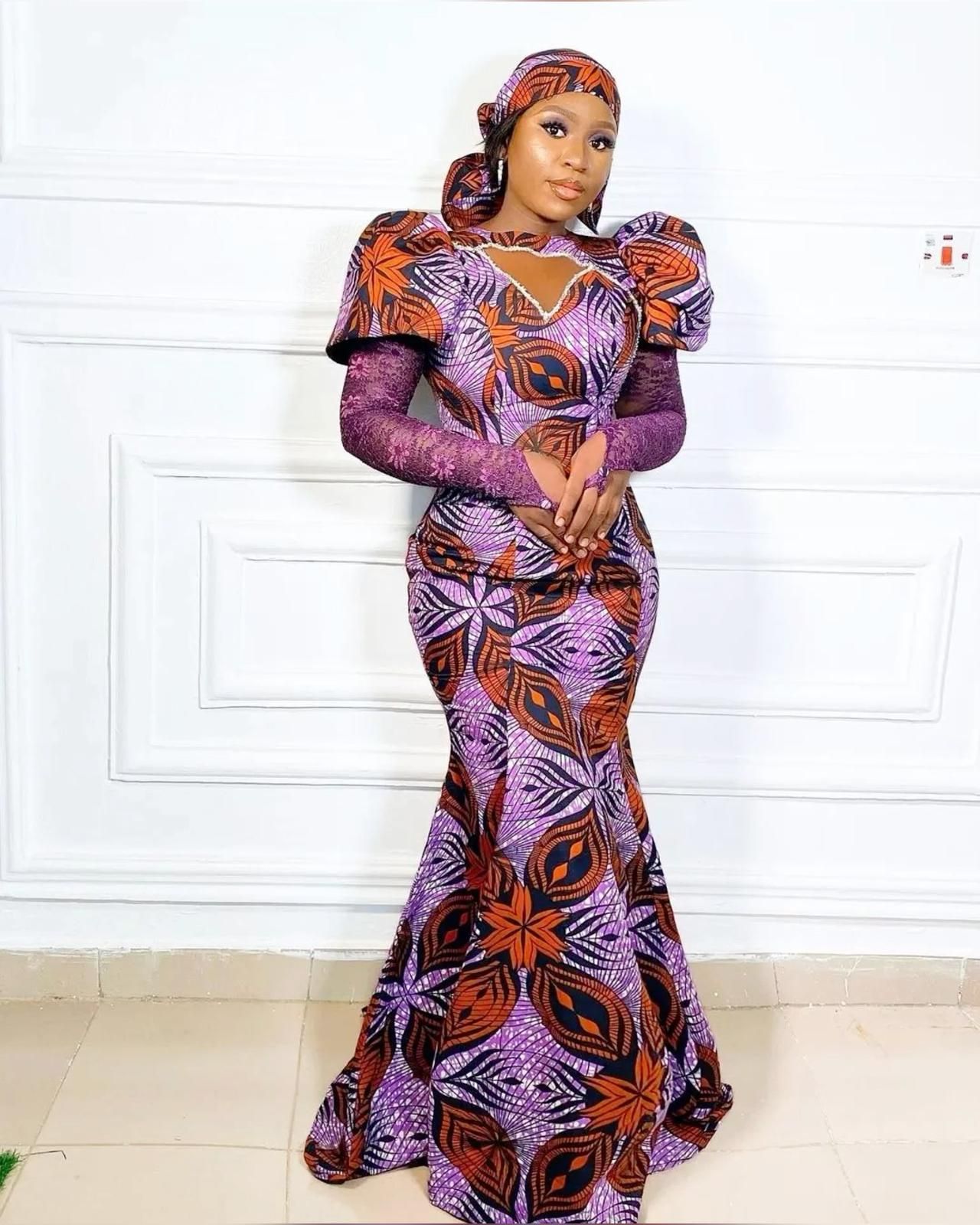 This contains an image of Ankara long gown