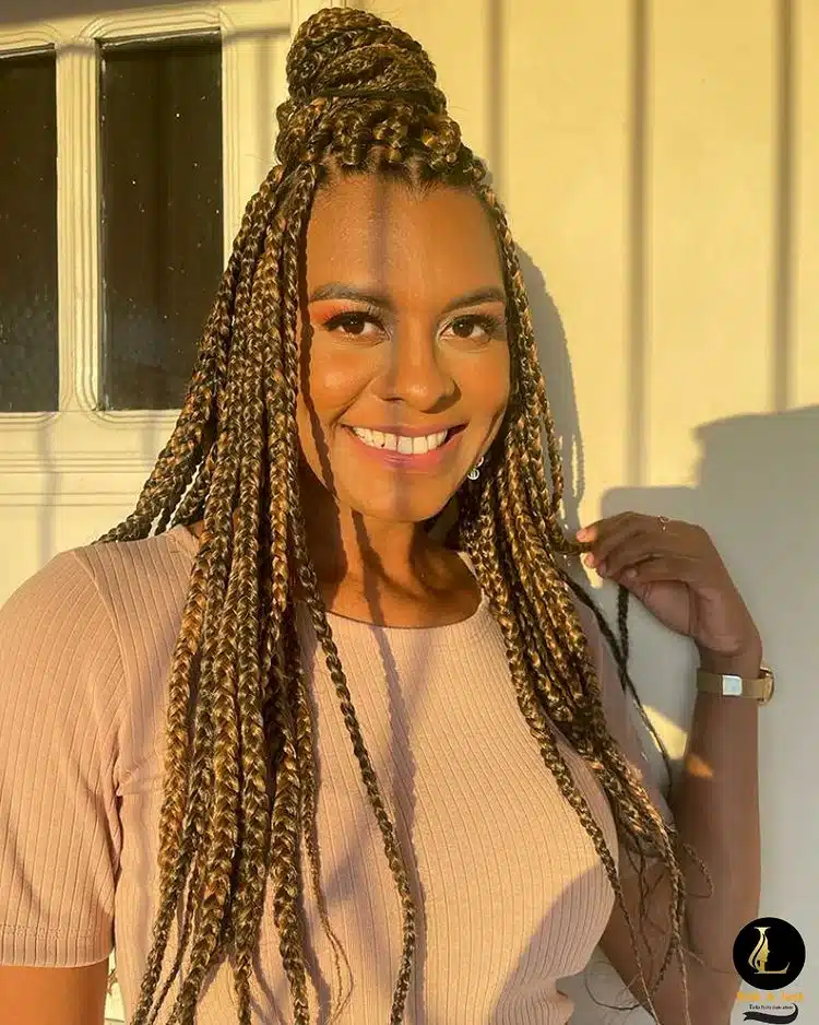 Small Blonde Box Braids With High Bun.jpg