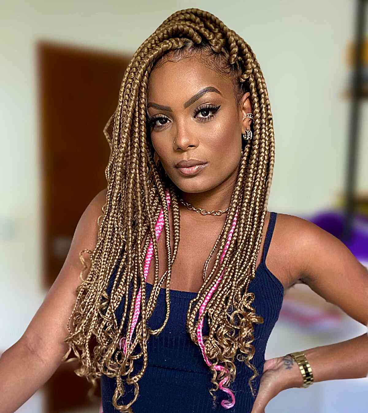 bold box braids with pink accents