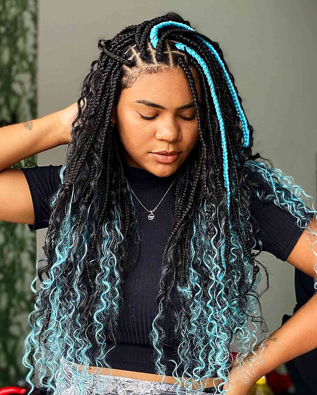stunning box braids with teal highlights for black women