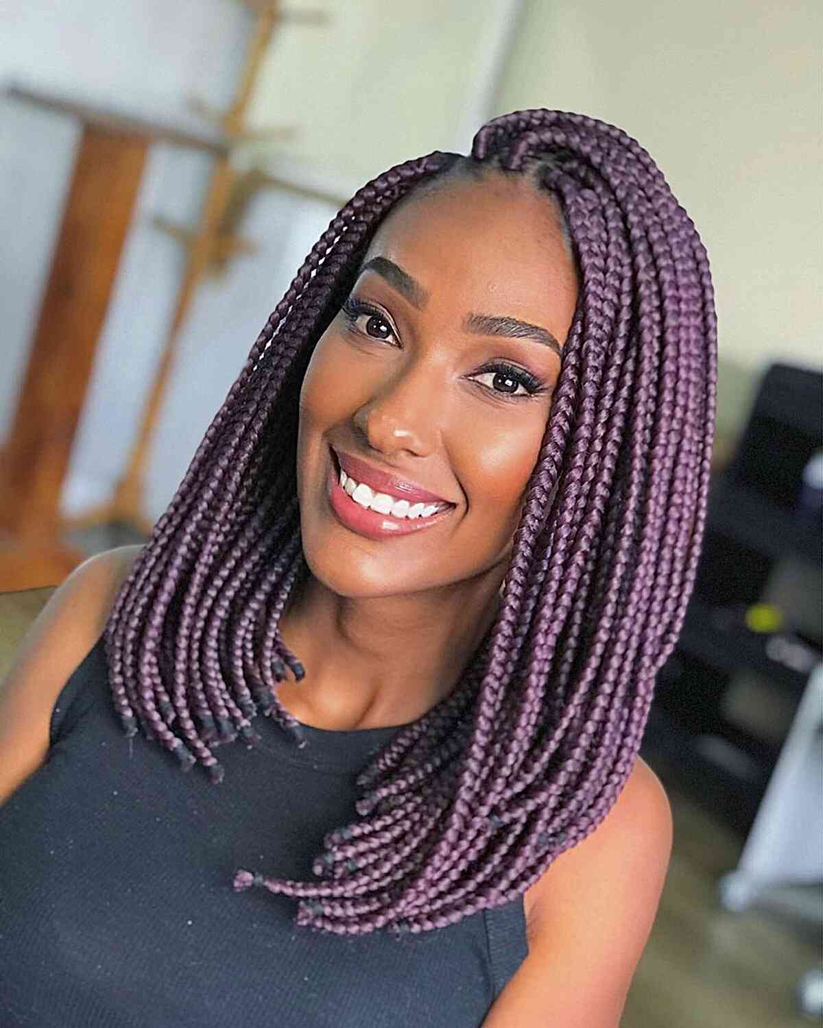 stunning purple box braids on a long bob