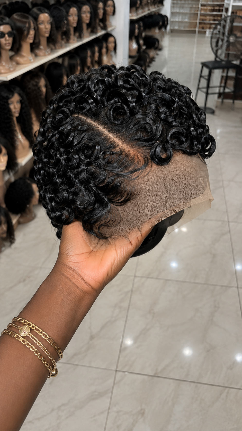 A Diagonal Part Line Divides High-Gloss Swirl Pin Curls Into Balanced Sculptural Sections #africanprintdesignersh A Diagonal Part Line Divides High-Gloss Swirl Pin Curls Into Balanced Sculptural Sections #africanprintdesignersh